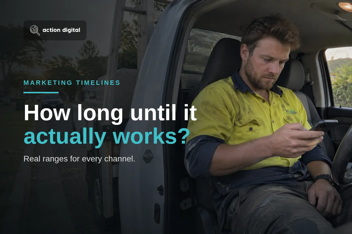 Tradesperson in a ute checking enquiries on his phone