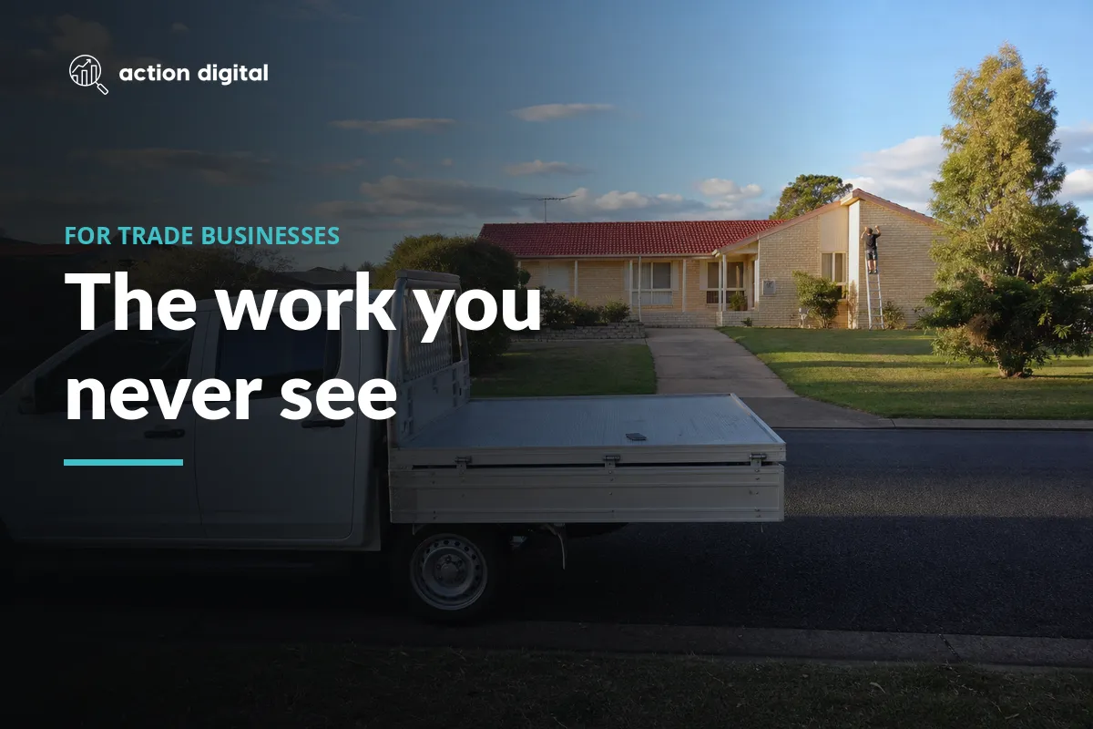 Tradie ute parked at the kerb with a phone on the tray while the owner is up a ladder at the house