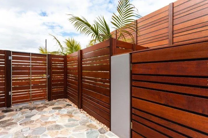 Modern horizontal wood slat fence installation by Paso Robles Fencing Pros, in Paso de Robles CA.
