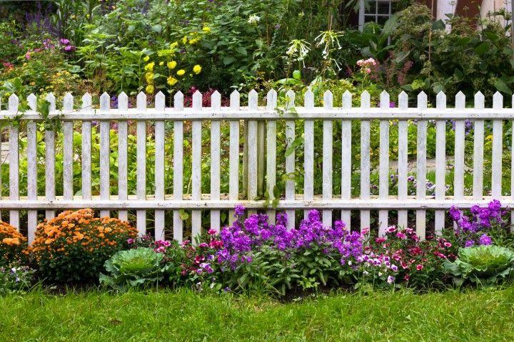 Sandusky Fencing Creations in Sandusky OH installing a classic white picket garden fence.