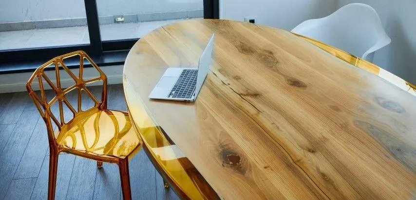 New Milford Carpentry Crafts in New Milford CT modern oval wooden dining table with white chairs.