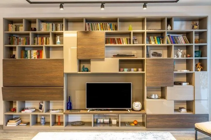 New Milford Carpentry Crafts in New Milford CT large custom wall entertainment center with shelving and television.