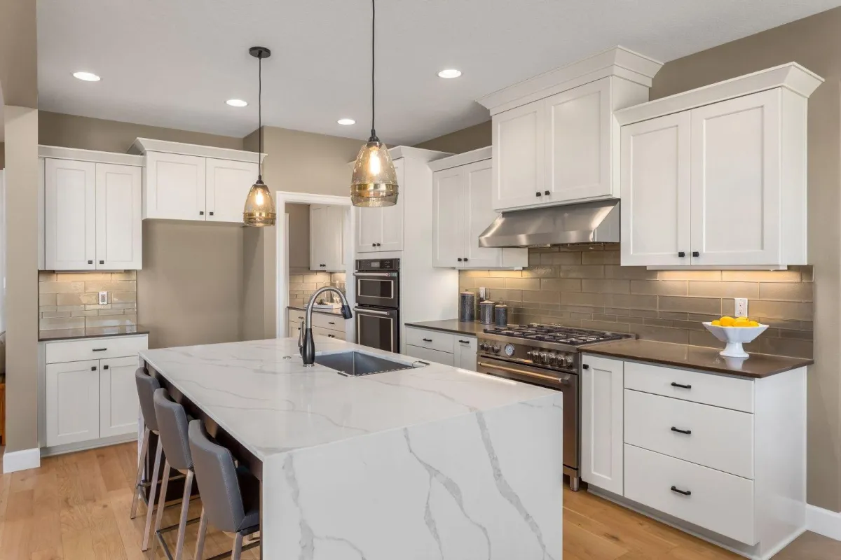 New Milford Carpentry Crafts in New Milford CT modern kitchen featuring white cabinets and marble island.