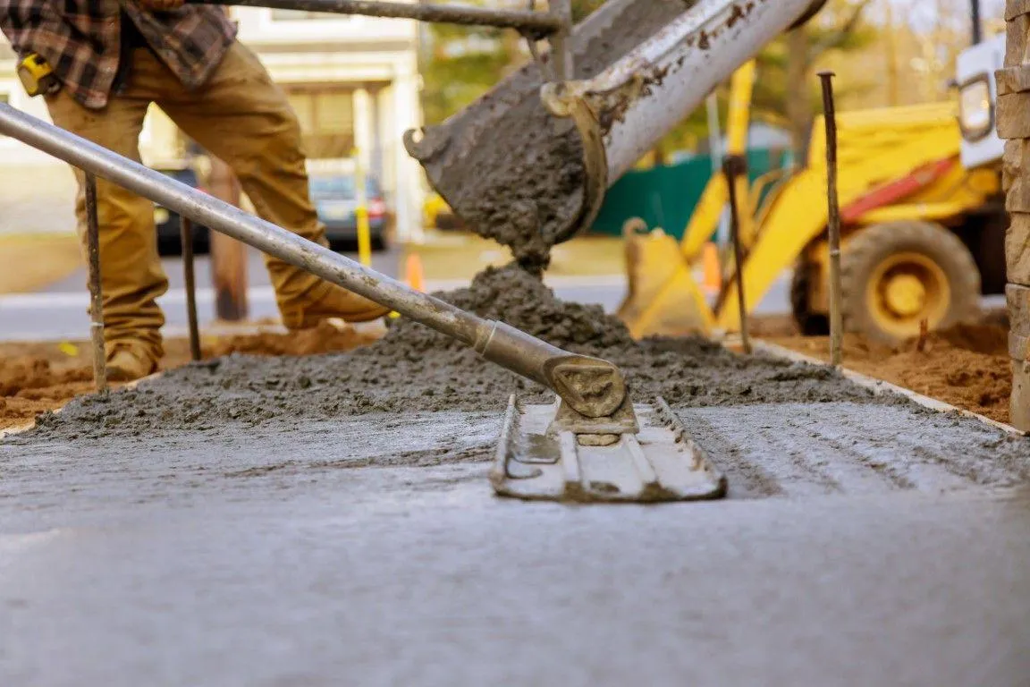 Aerial view of a concrete contractor in Dania Beach FL pouring a building foundation with a boom pump.