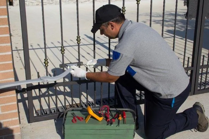 Sandusky Fencing Creations in Sandusky OH installing and servicing an automated metal gate system.