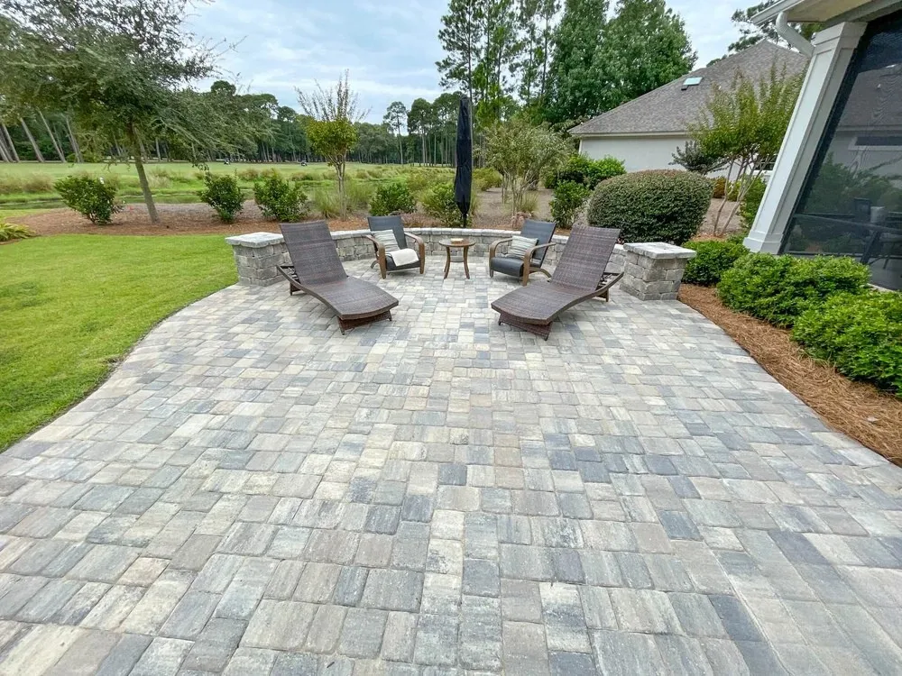 Paver patio with lounge chairs and outdoor seating area built by Liberty Landscape & Construction in Ventura County, CA.