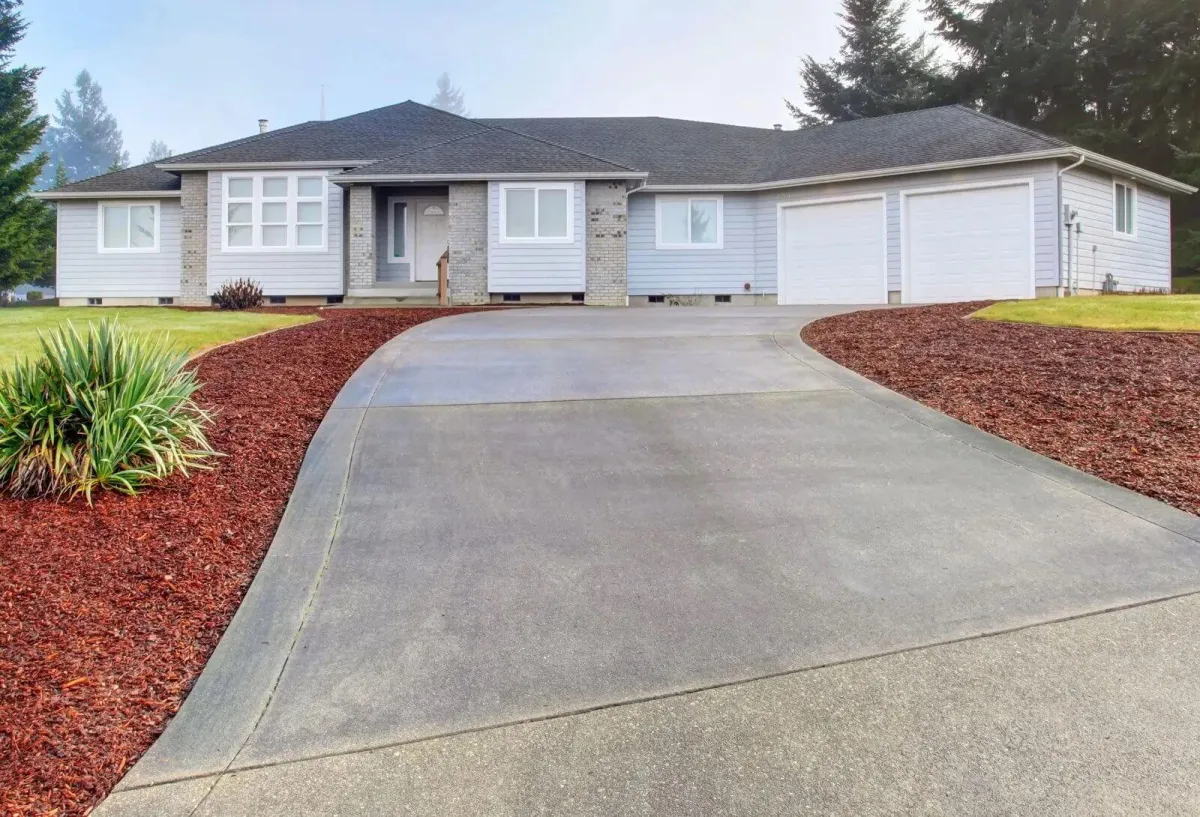 New concrete driveway and landscape design completed by Liberty Landscape & Construction in Ventura County, California.