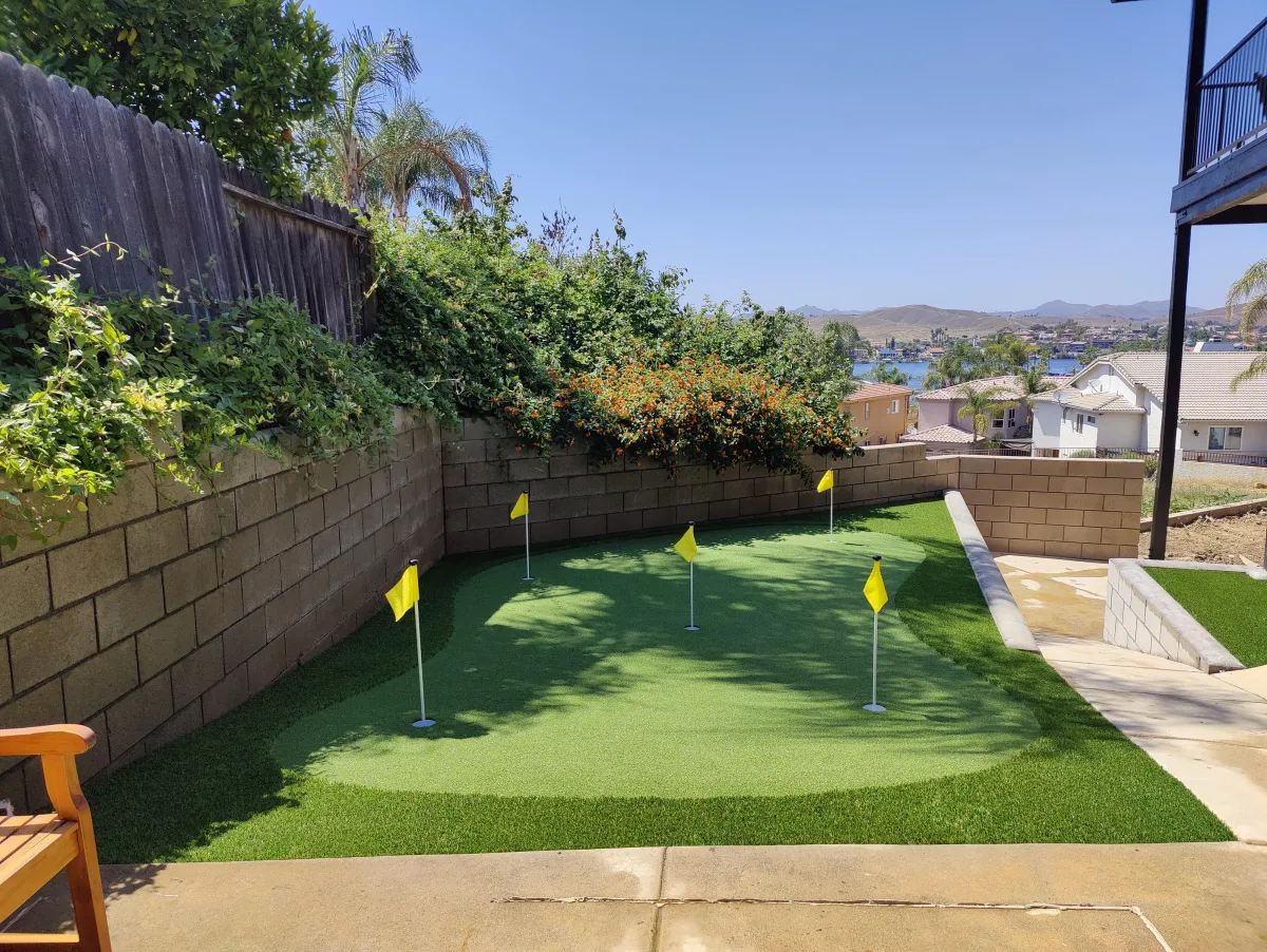 Backyard putting green installation by Liberty Landscape & Construction in Ventura County, CA — realistic synthetic golf turf design.