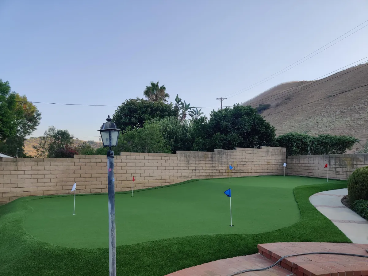 Custom backyard putting green with premium artificial turf installed by Liberty Landscape & Construction in Ventura County, California.