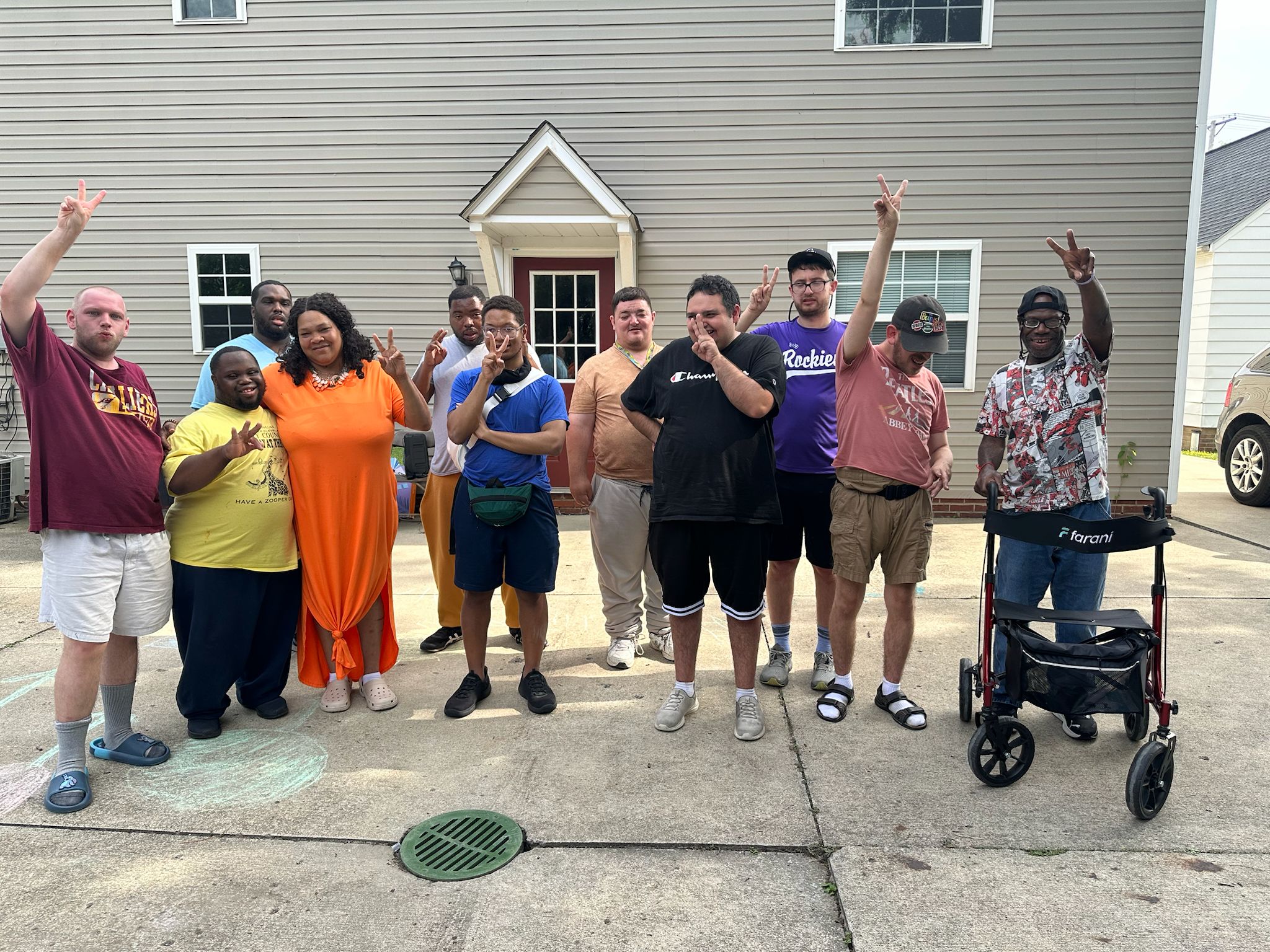 House of the Year award photo with residents and staff in front of the home.