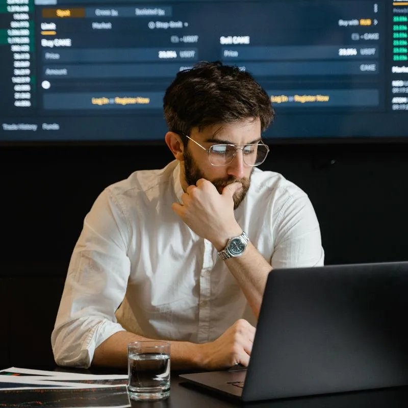 man monitoring data on a laptop