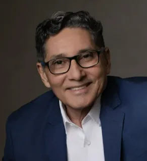 man in white dress shirt wearing white goggles