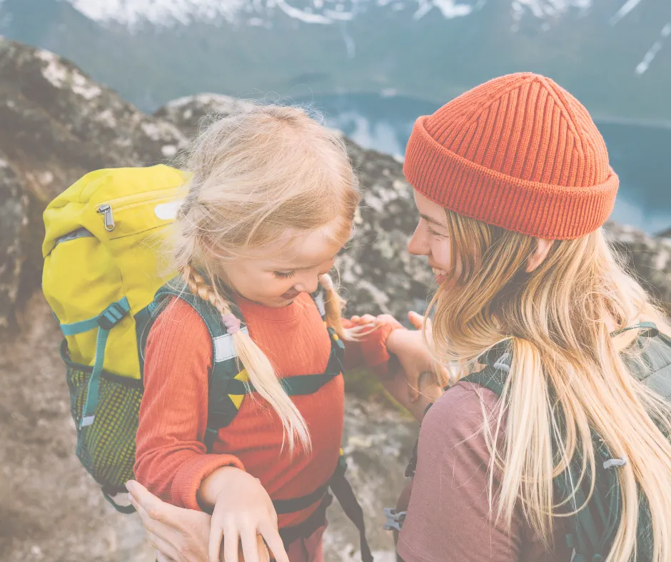 Mom calmly holding her child in a public space, looking confident and relaxed.
