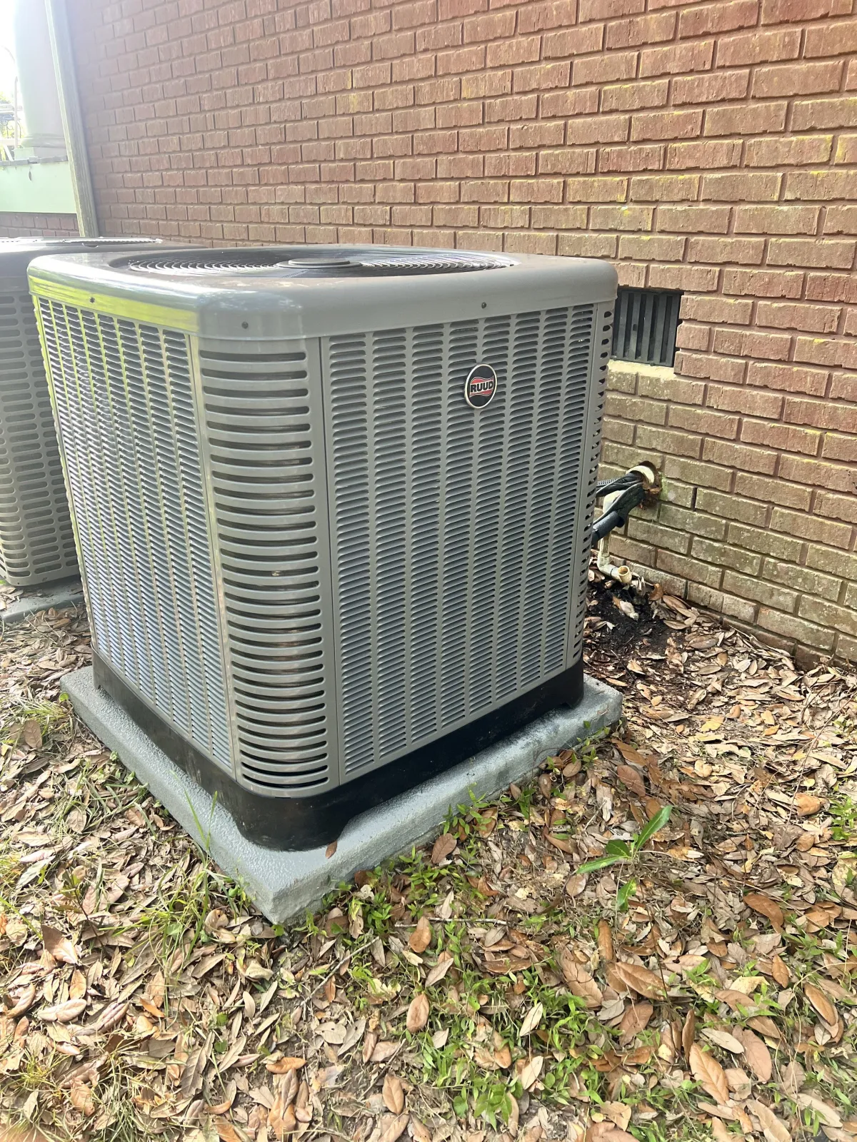 Tall apartment building with balconies under stormy sky