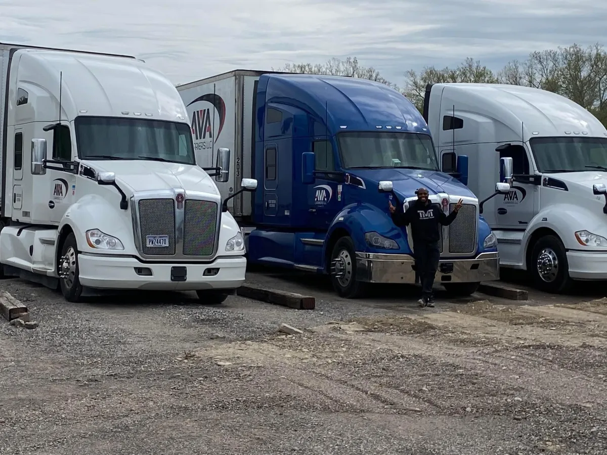 blue and white ship on white sand during daytime