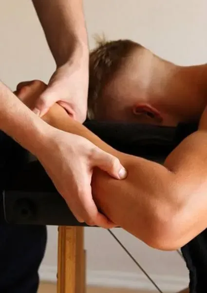 903 physical therapist helping man through lymphedema therapy