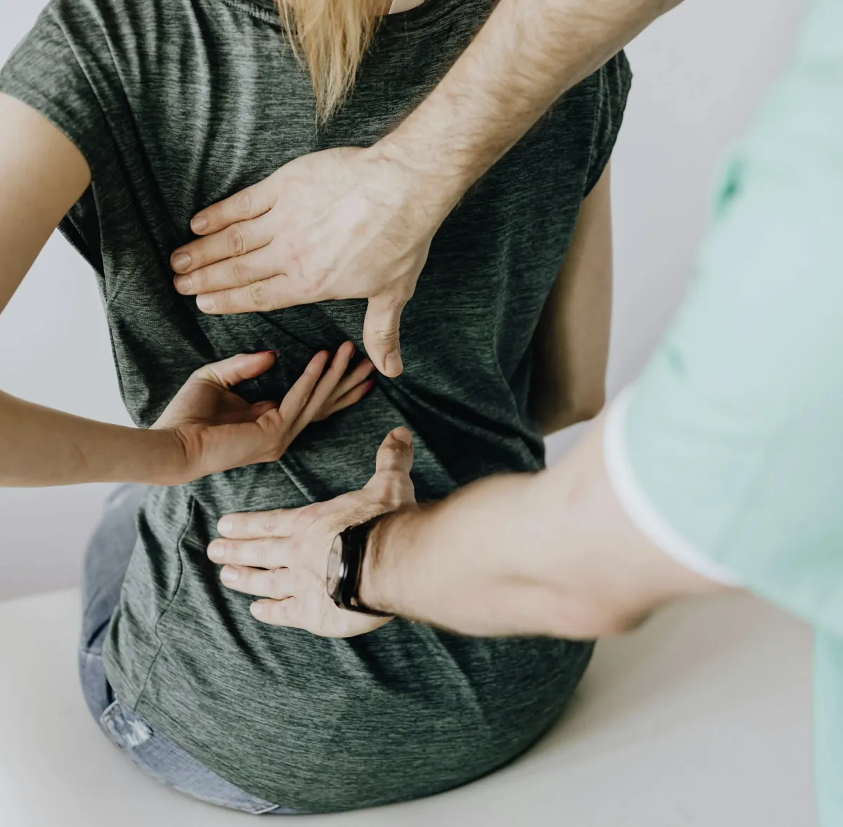 903 physical therapist helping a women through manual therapy