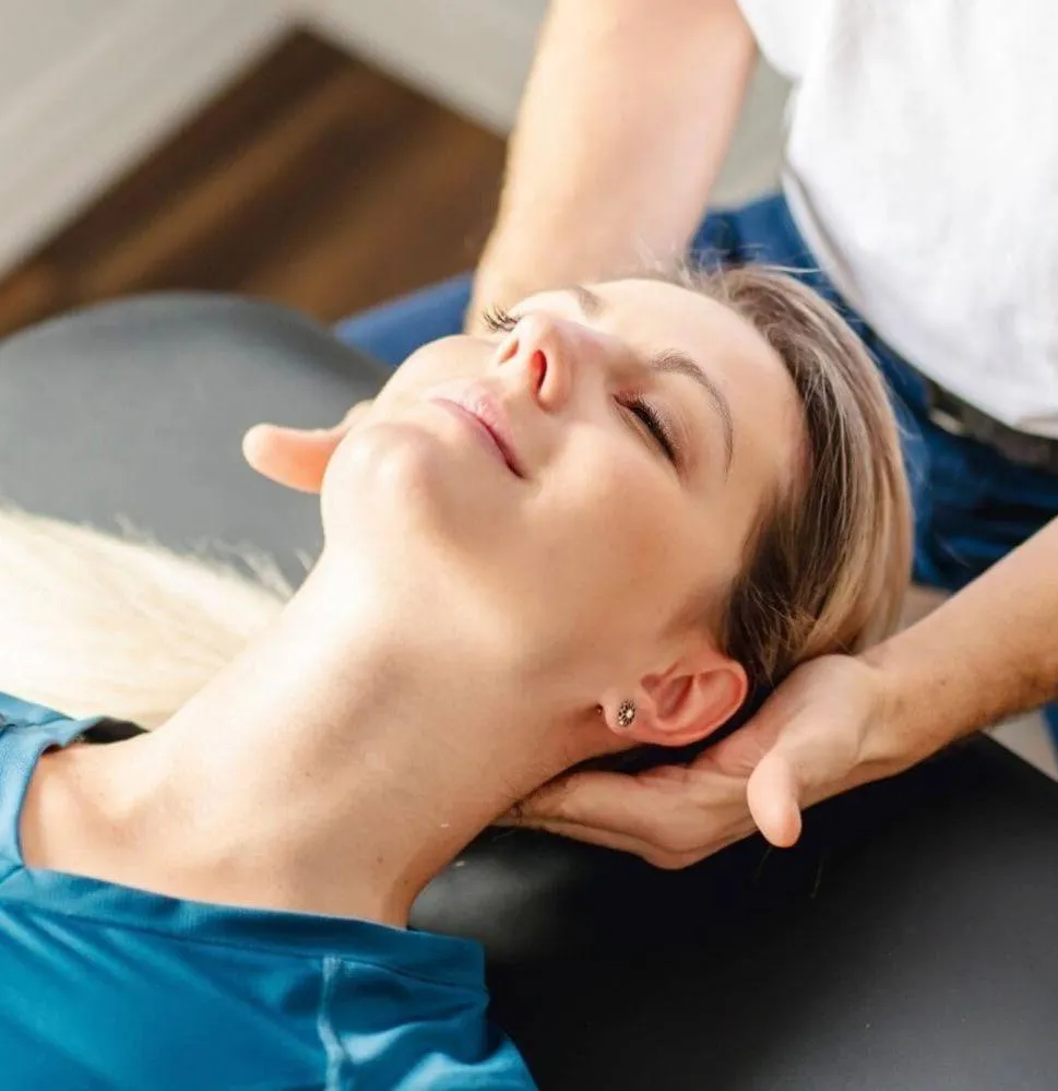 903 physical therapist helping a women through vestibular therapy