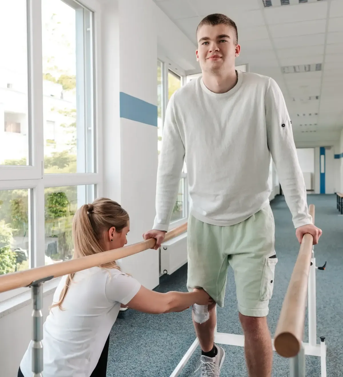 physical therapist helping man with a running injury recovery through physical therapy at 903 Physical Therapy in whitesboro, texas