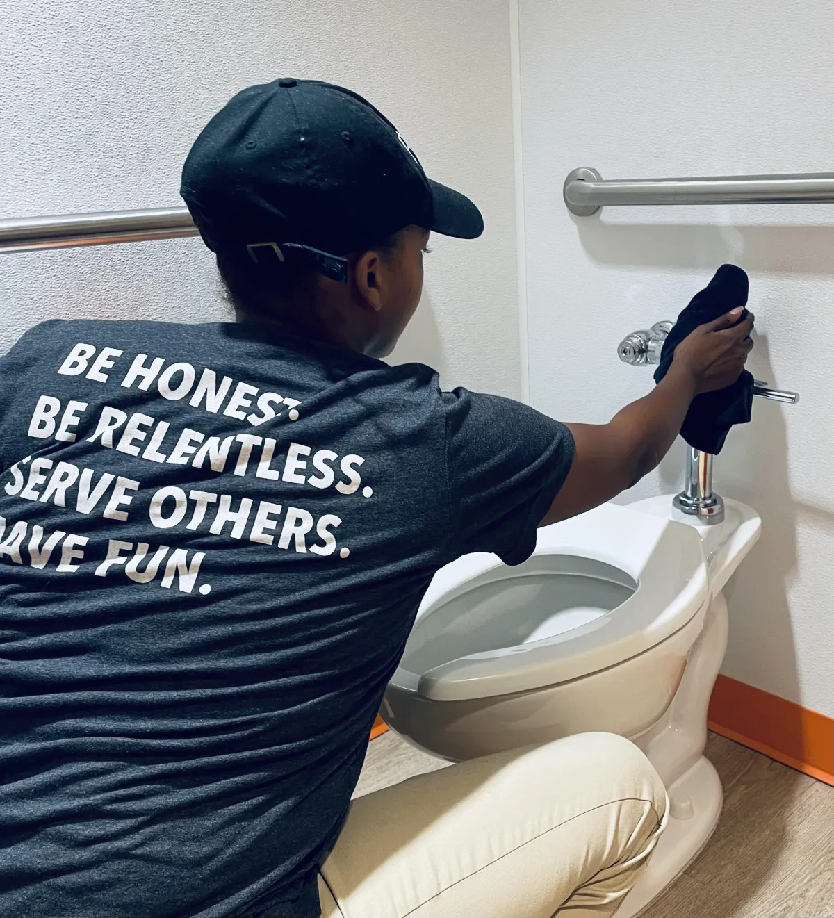 Cleaning a toilet for a business