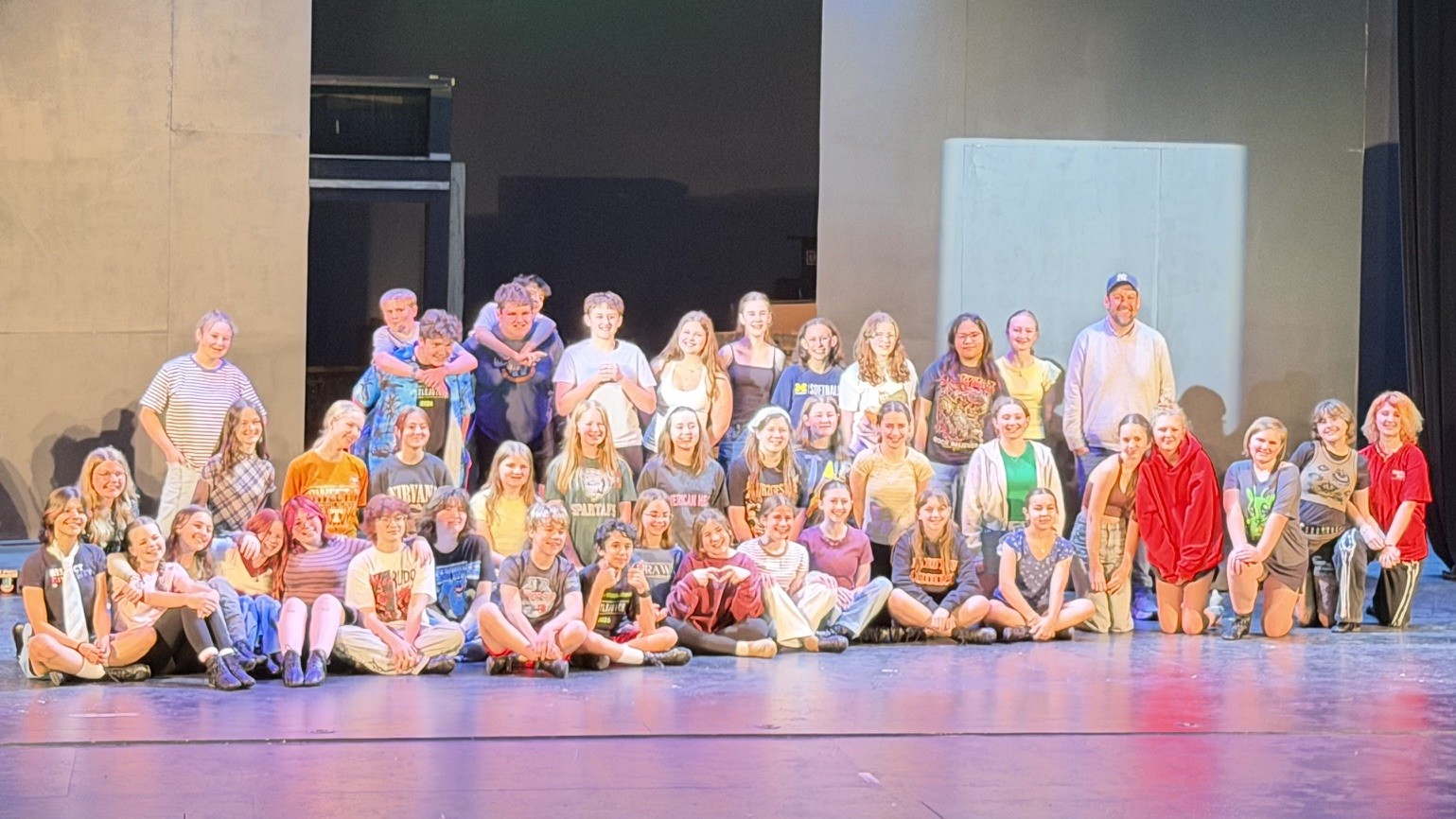 Young man playing electric guitar on stage
