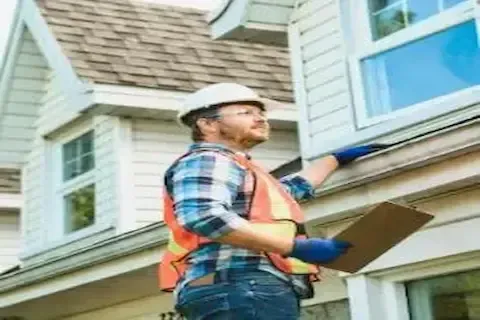 Certified roof inspector reviewing roofline and fascia for Woodbury Roofing Pros