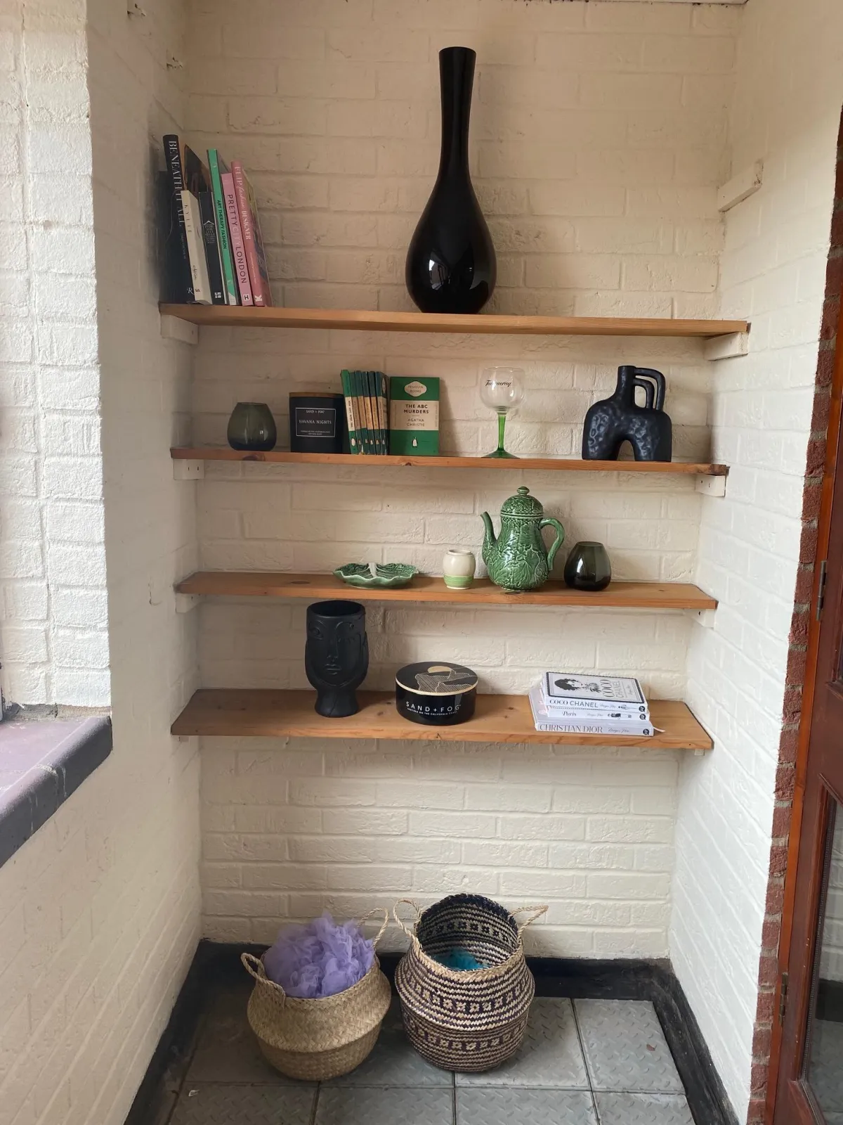 Collection of coordinating accessories on wooden shelves