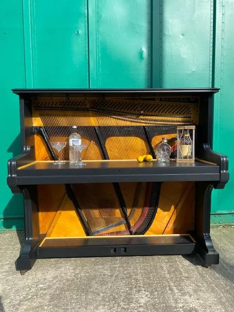 Golden coloured vintage piano upcycled into a piano bar 