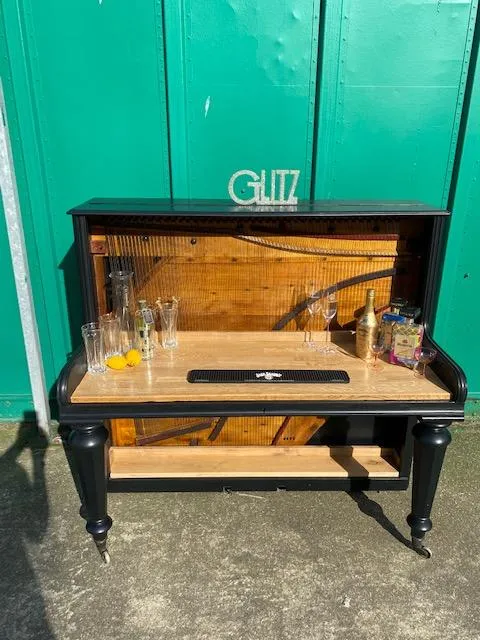 Pretty little piano upcycled into a piano bar 