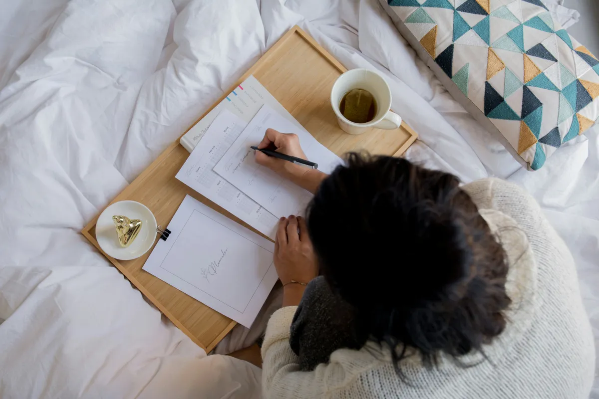 writing on a notebook