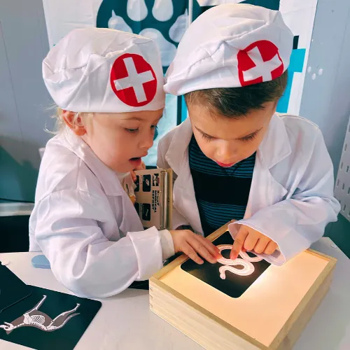 Girl follows directions during arts and crafts time.