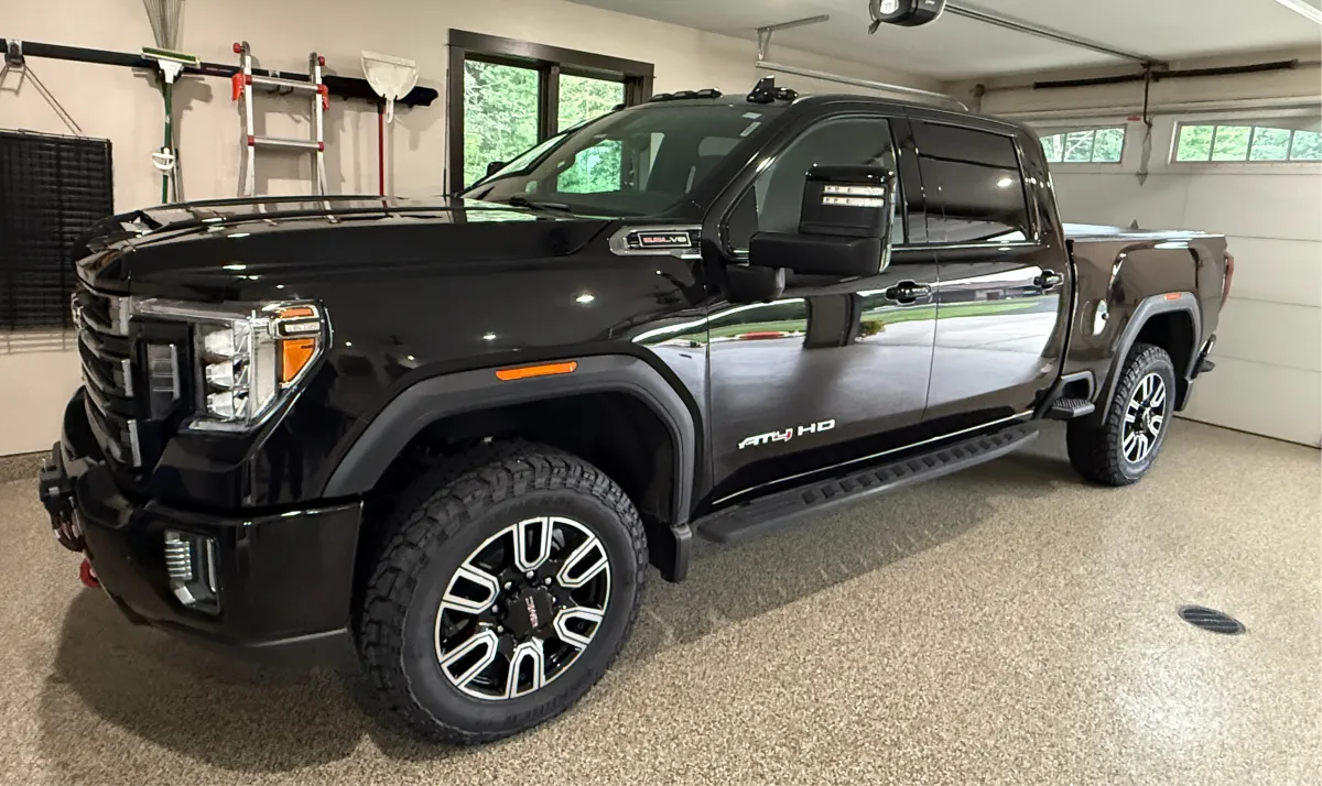 Black GMC pickup truck detailed with ceramic coating in Eau Claire WI for durable exterior protection and mirror-like finish
