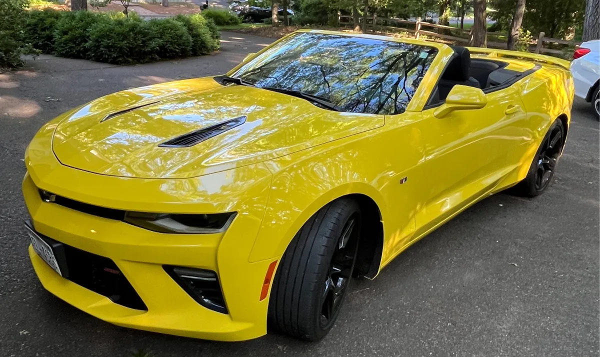 Yellow Chevy Camaro sports car ceramic coated in Eau Claire WI for vibrant shine and long-term paint durability