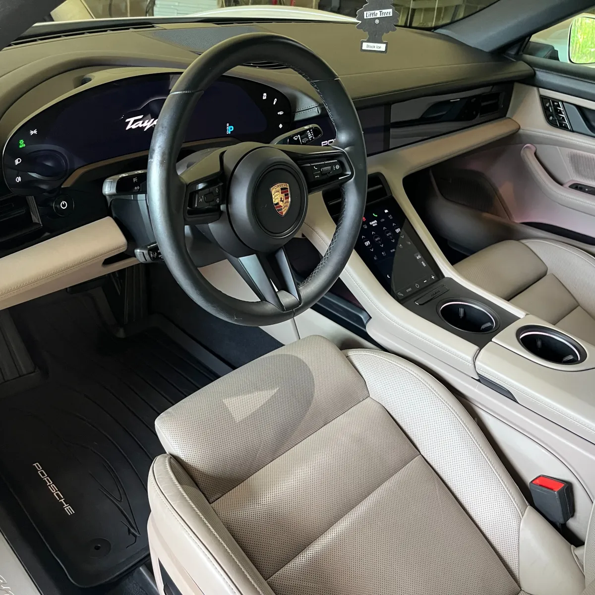 White Porsche Taycan electric car interior detailing and protection service in Eau Claire WI for spotless luxury finish