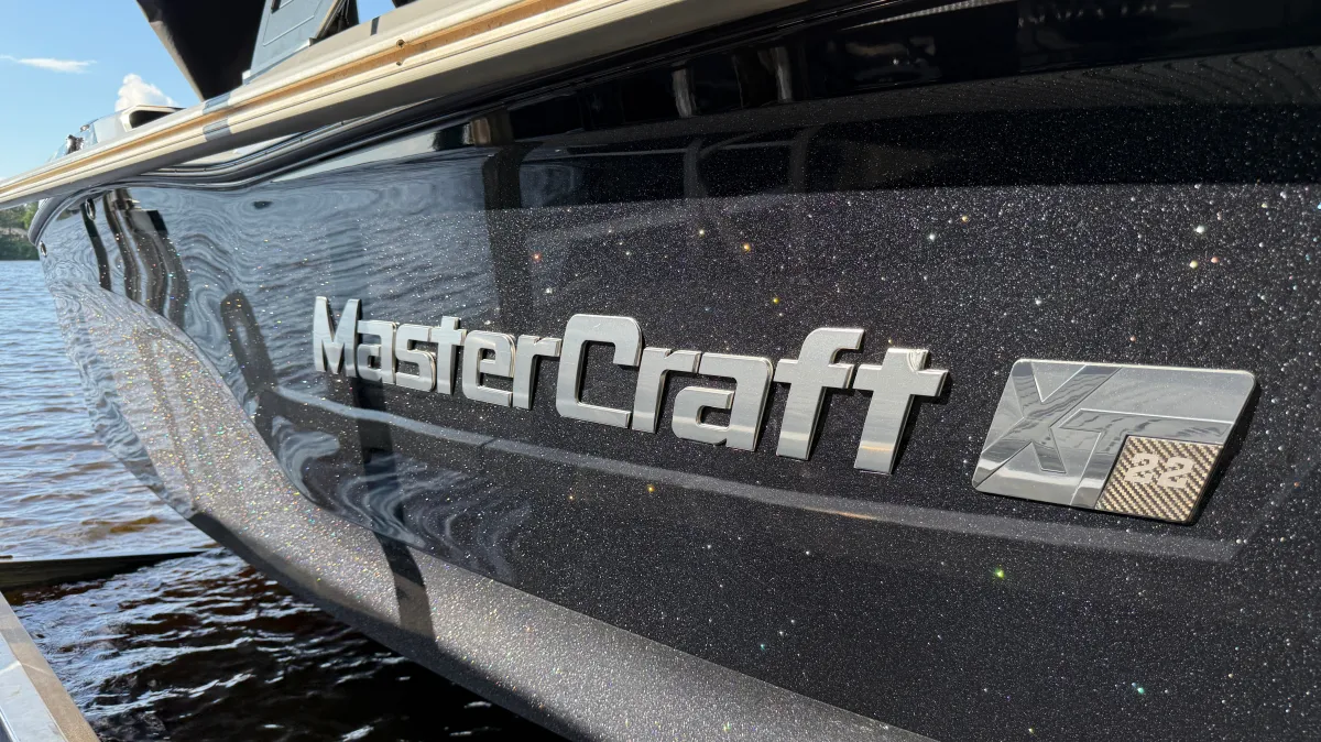 Black and silver Mastercraft boat exterior after professional paint correction and wax in Chippewa Falls WI