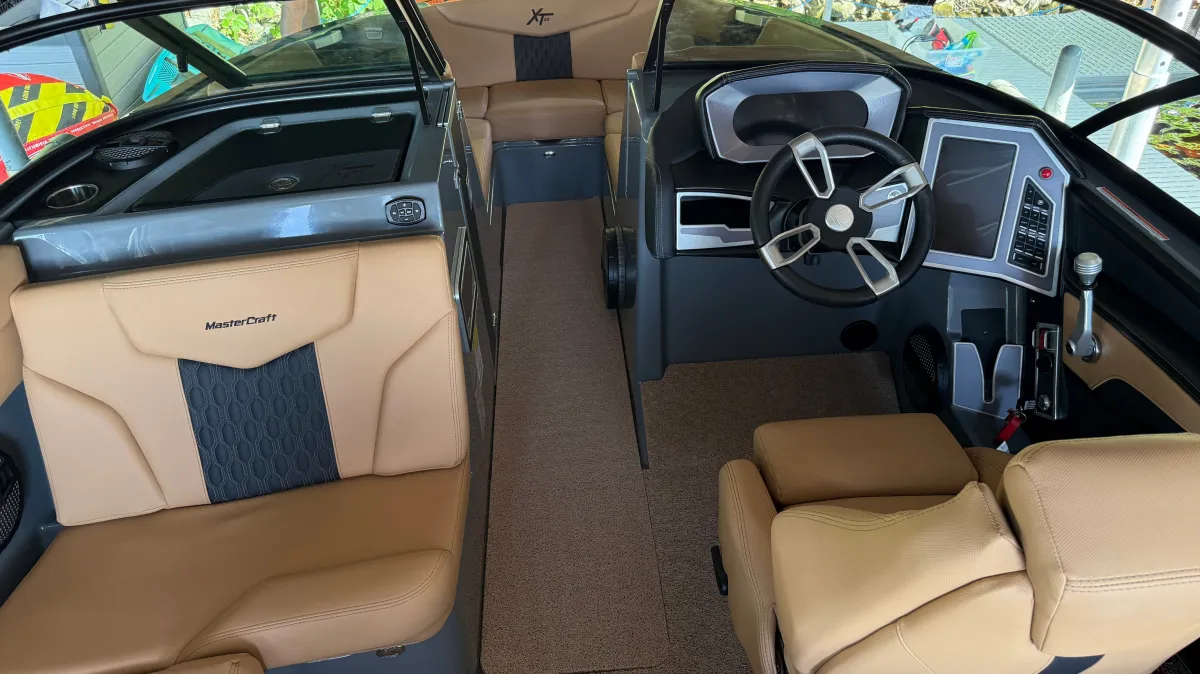 Tan vinyl interior of Mastercraft speed boat detailed on Lake Wissota Chippewa Falls WI with interior protection service
