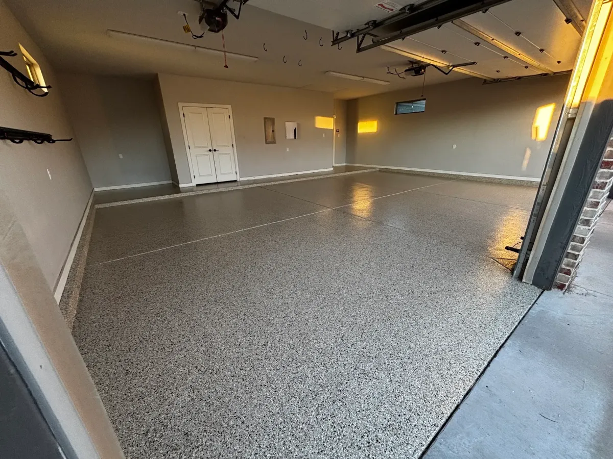 gray flake garage floor coating in a residential garage in Midland, TX