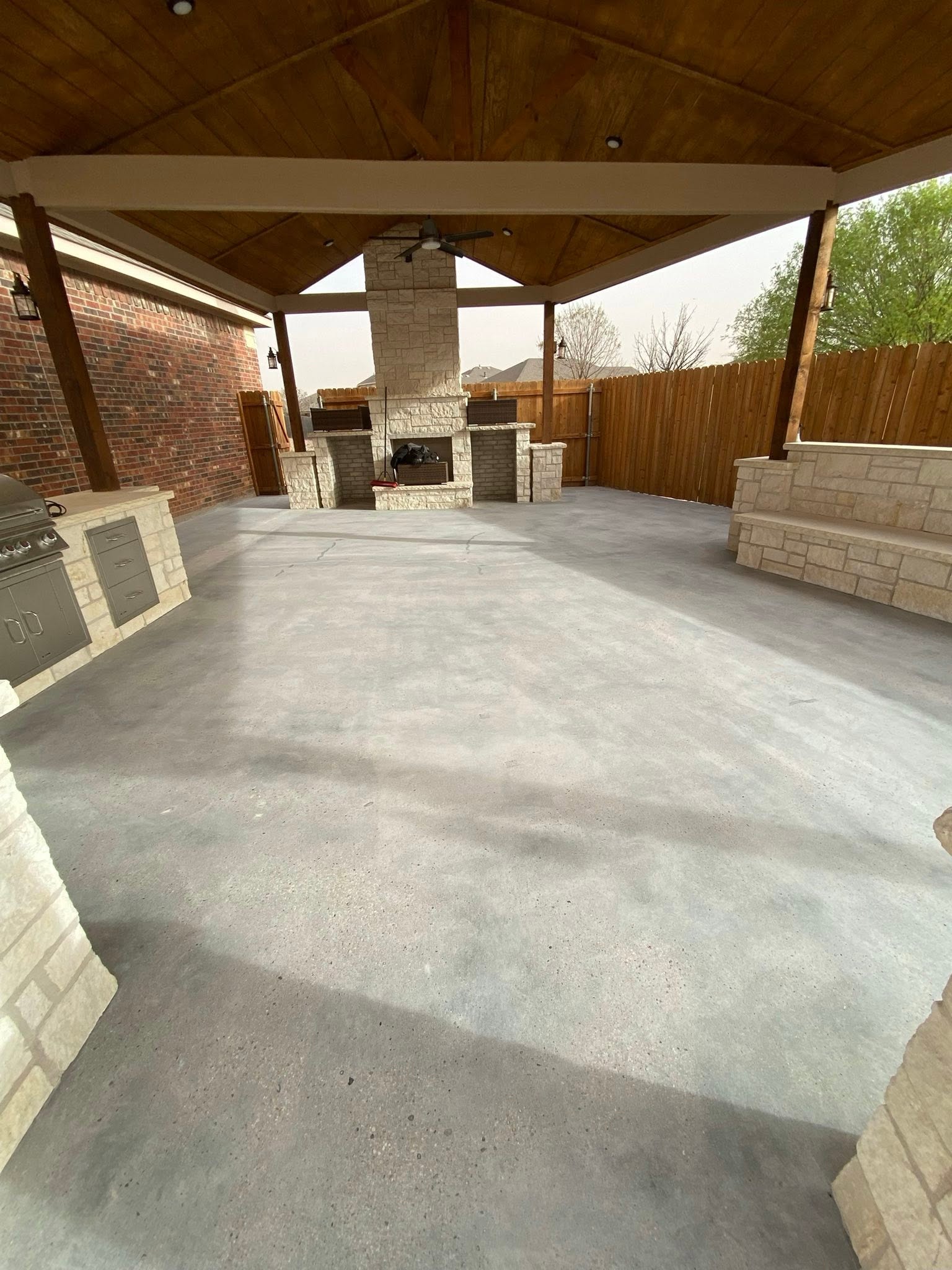 cracked back patio concrete before coating in Midland, TX
