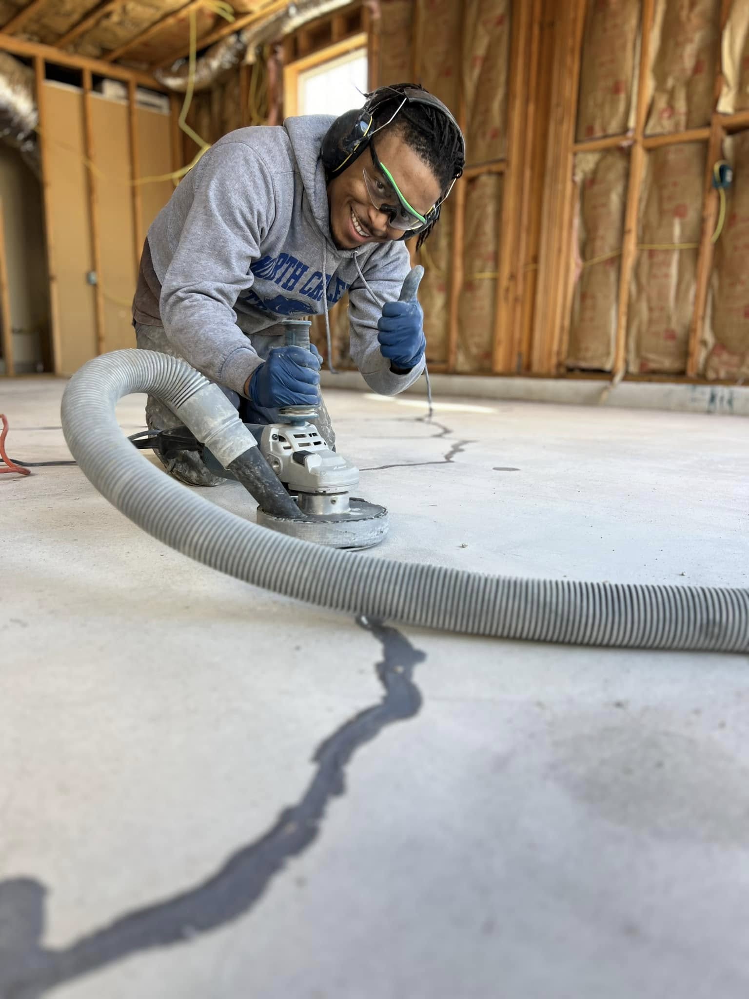 Home Run Concrete Coatings team installing a floor in Odessa, TX