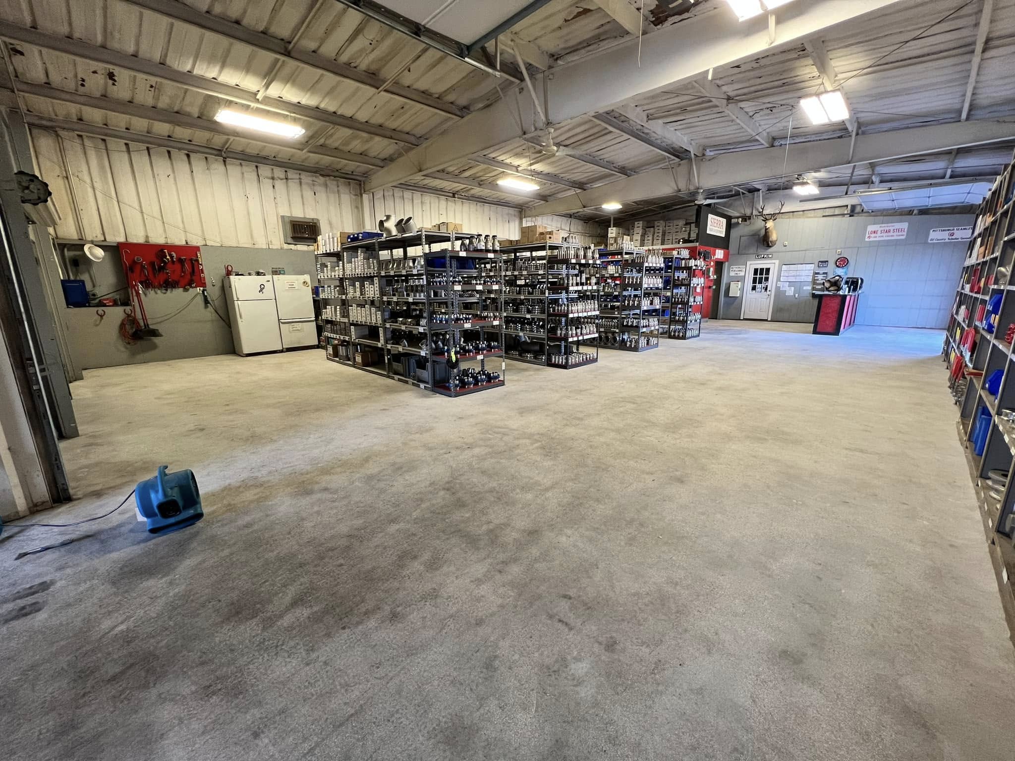 worn shop floor before coating in Midland, TX