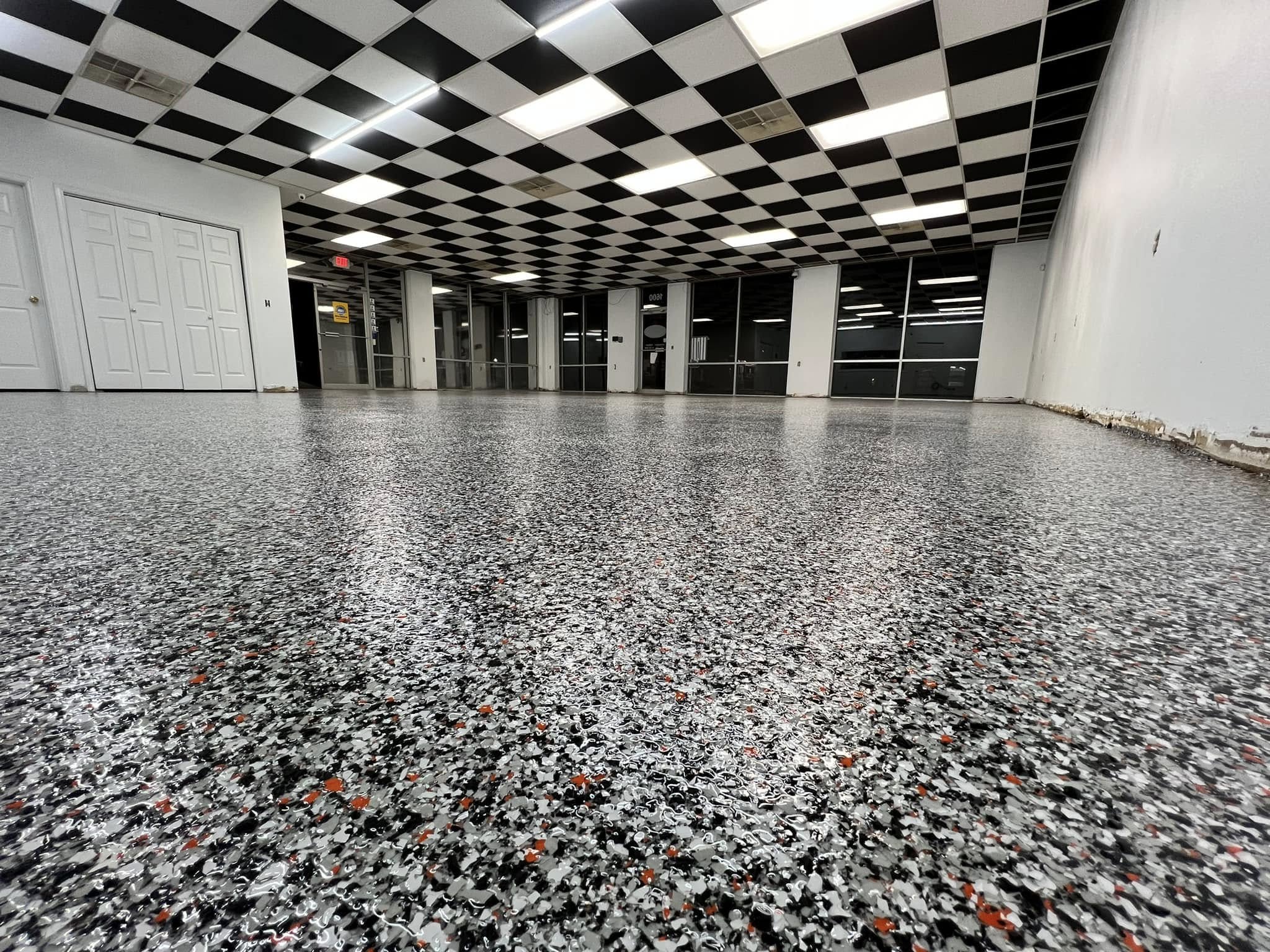 black and white flake floor in a commercial showroom in Midland, TX