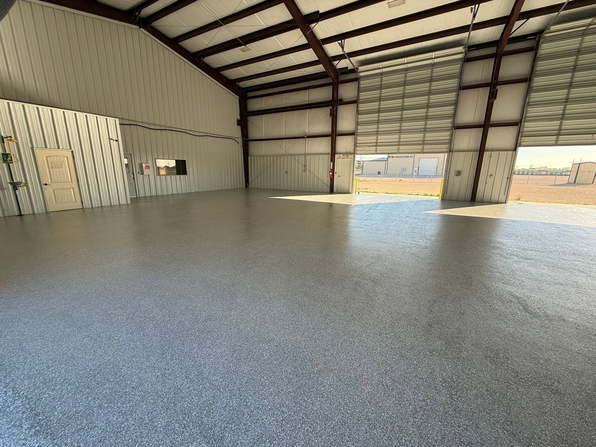 flake floor coating in a metal barndominium shop in Midland, TX