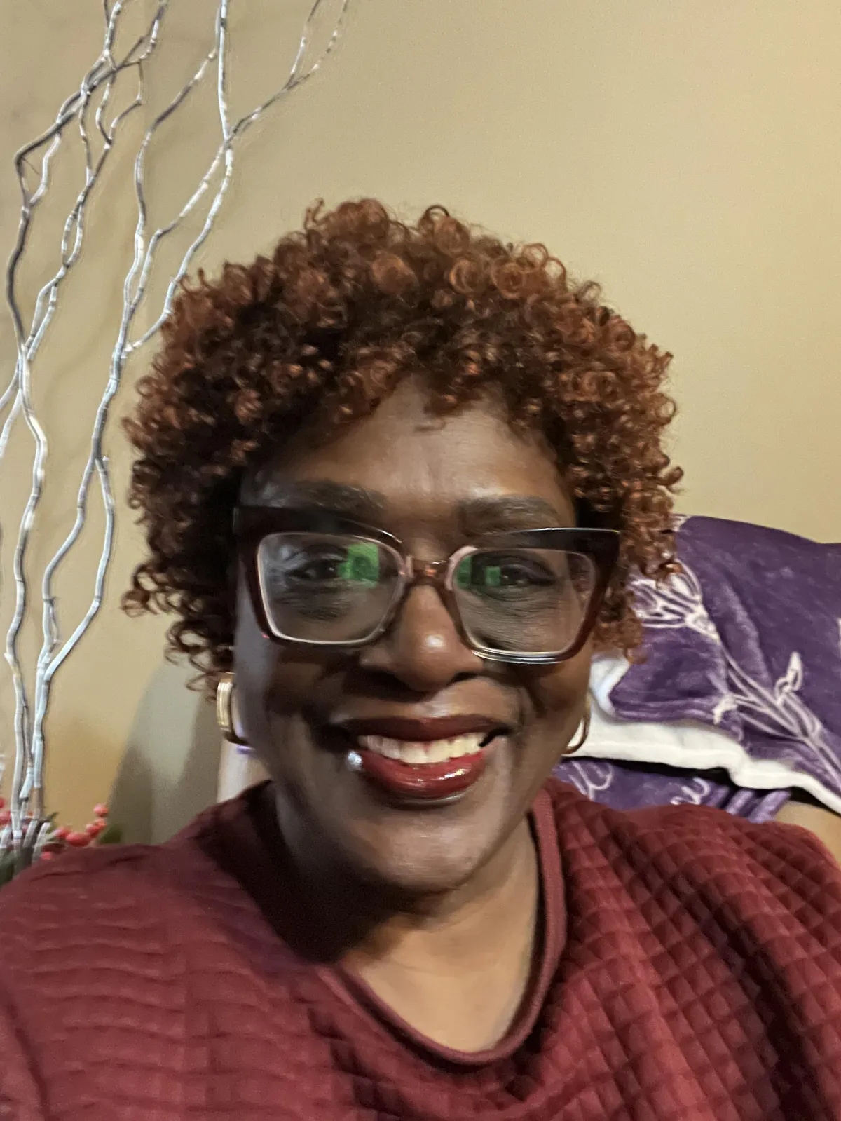 short-haired black cat besides brown wooden table