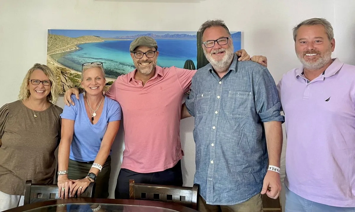 Happy buyers and sellers at a Dream Baja Realty closing