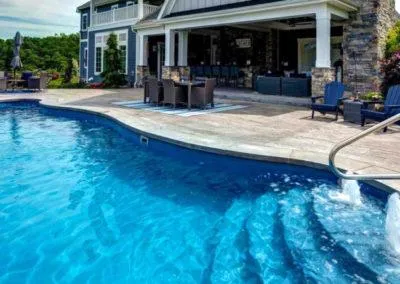 a large building with a pool in front of it
