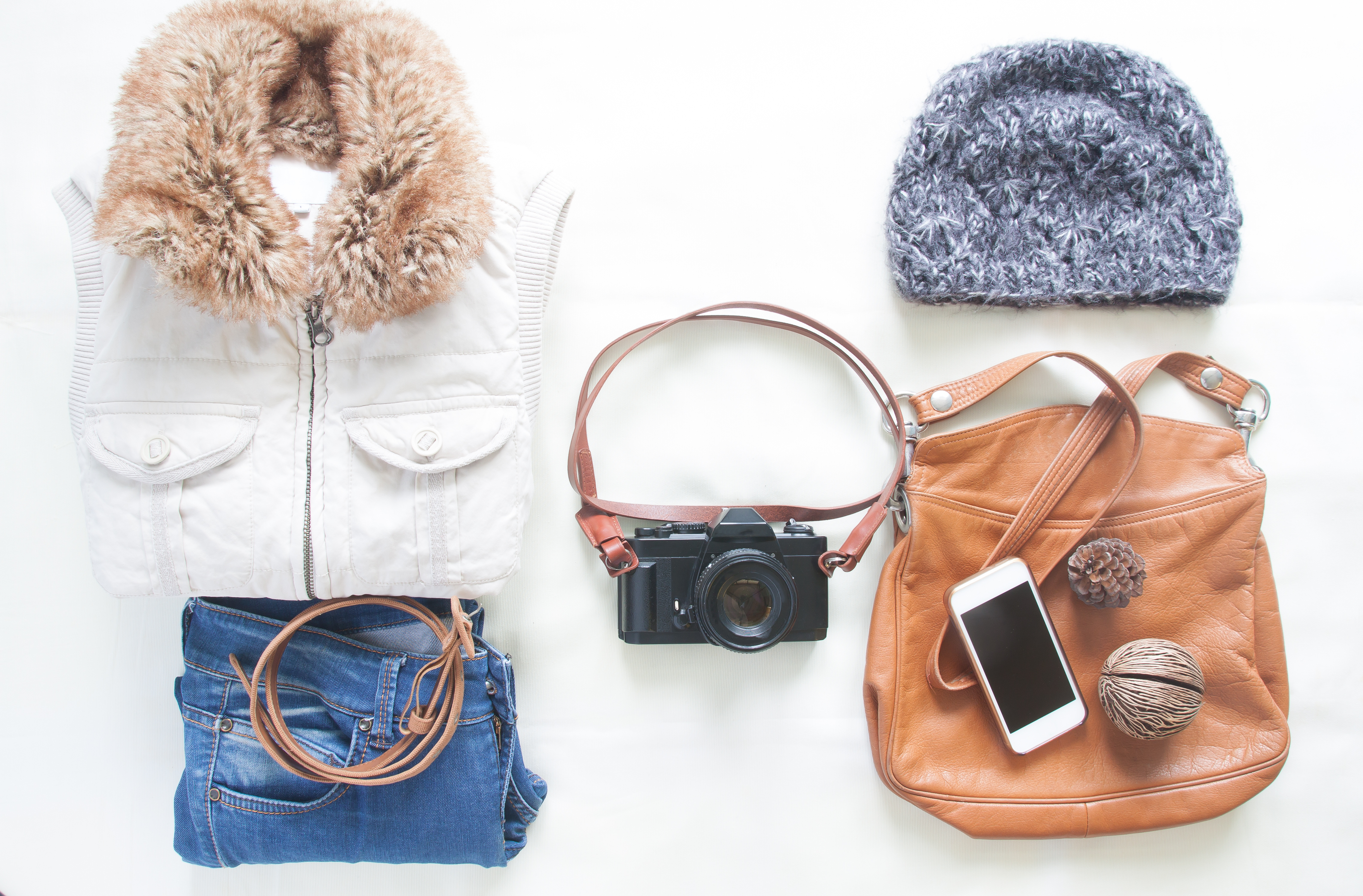 Curated pre-owned items including a vintage camera and jewelry
