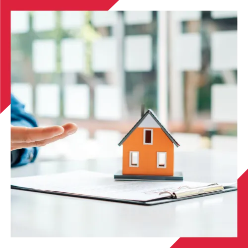 Home insurance policy documents and keys on a wooden table