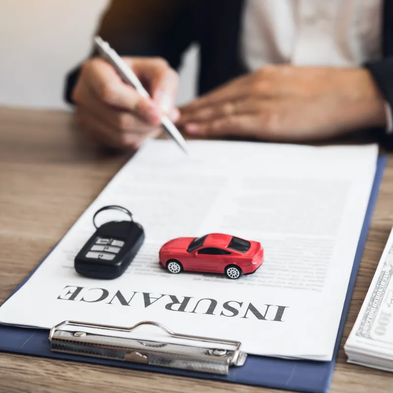 Driver comparing auto insurance in Riverside, CA with local help