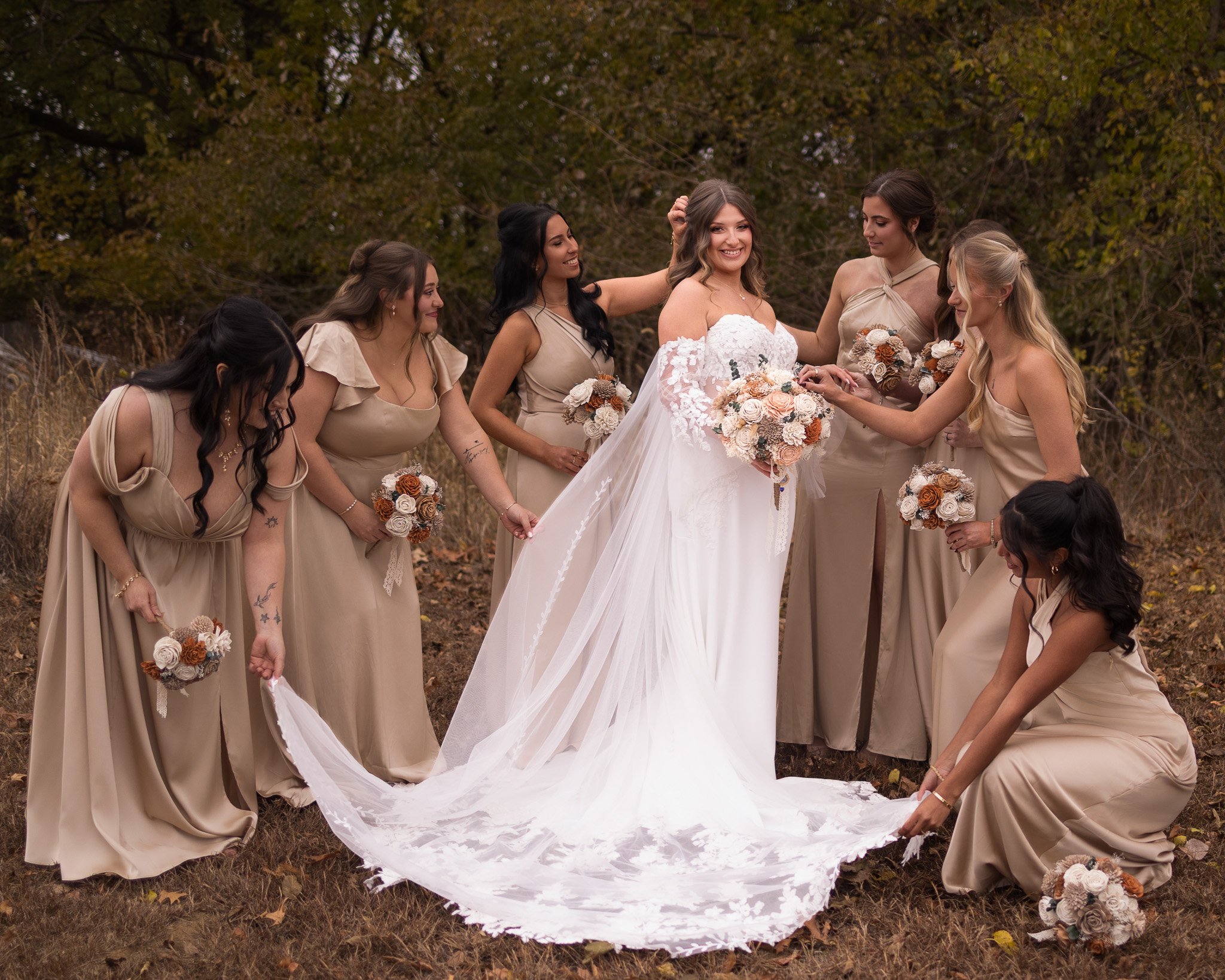 bridesmaids helping bride get ready for the big moment