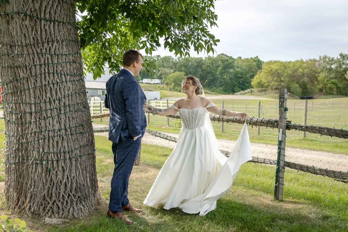 Bride and groom enjoying relaxed golden-hour portraits during their Minnesota wedding
